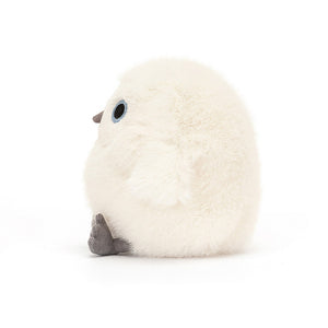 Side View: Jellycat Snowy Owling standing on its side, showcasing its compact size (11 cm x 7 cm) for little hands to hold. The side profile reveals the depth of the plush, the softness of the fur, and the textured details on the face.