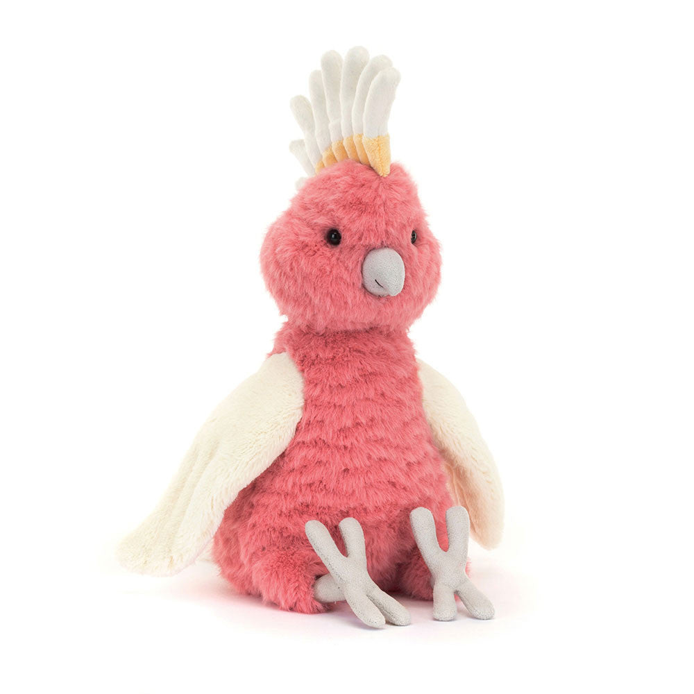 Front view of Jellycat Squawkatoo – pink plush parrot toy with white wings and a yellow-white crest.