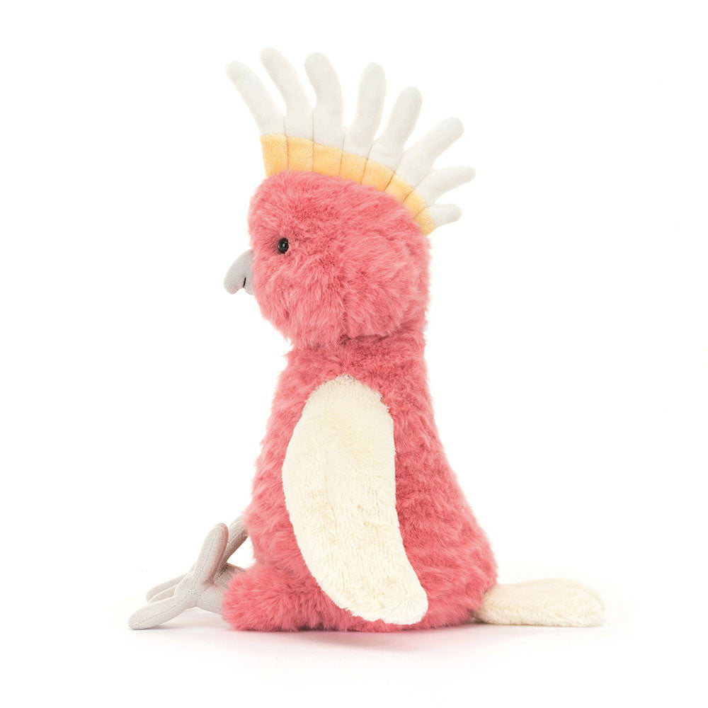Side profile of Jellycat Squawkatoo soft toy showing fluffy texture and curved beak.