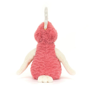 Back view of Jellycat Squawkatoo plush with ivory wings and tail against a pink furry body.