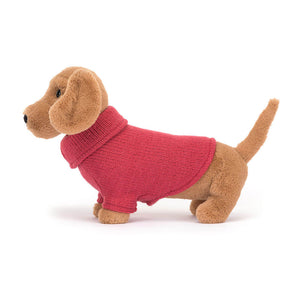 Side view of Jellycat Sweater Sausage Dog Pink showcasing its long body, soft texture, and wagging tail.