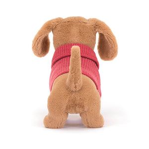 Back view of Jellycat Sweater Sausage Dog Pink highlighting its knitted sweater and plush fur.