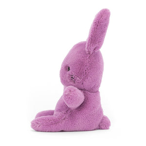 Side View:  Ready for a pocket adventure! Jellycat Sweetsicle Bunny boasts perky purple fur, big floppy ears, and a tiny pink nose. Perfect for cuddles on-the-go!