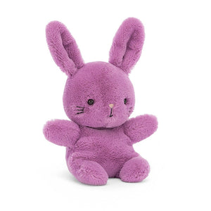 Angled View: Sweetsicle Bunny by Jellycat tilts its head, ready for a hug! This perky purple bunny has super soft fur, big floppy ears, and a cute pink nose. 