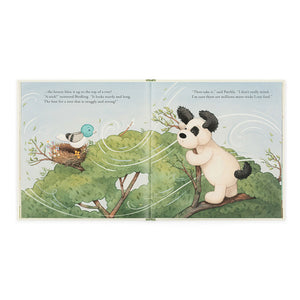 Jellycat The Pick of the Sticks book, open to an inside spread, showing Patchly Puppy interacting with his friends in a beautifully illustrated scene.