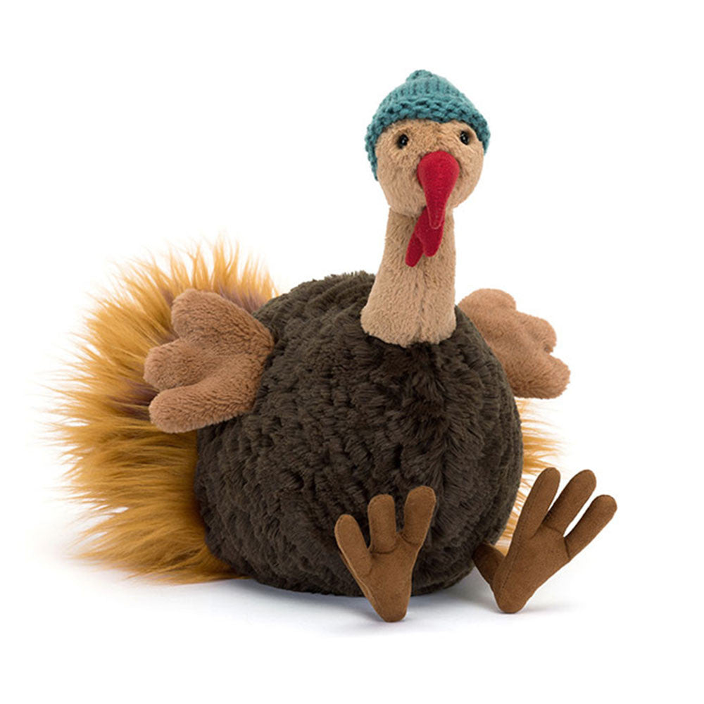 Jellycat Theo Turkey plush toy with fluffy amber tail and teal knitted beanie.