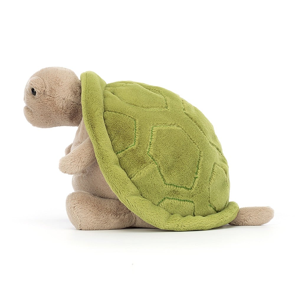 Jellycat Timmy Turtle standing tall, showcasing his cuddly size (28 cm x 20 cm) for big hugs. The side profile reveals the depth of the plush, the softness of the fur, and the textured details on the green shell.