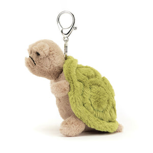 Side View: Side profile of the adorable Jellycat Timmy Turtle Bag Charm. Highlights the compact size (perfect for any bag!), the soft, huggable form, and the captivating details like the embroidered shell and grumpy expression. A grumpy little friend for all your adventures! 