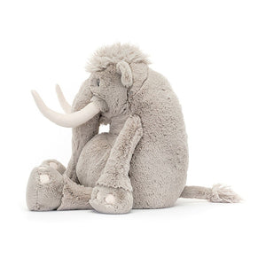Side View: Jellycat Vigo Mammoth is the perfect size for big prehistoric cuddles. The side profile reveals the depth of the plush, the floppiness of the legs, and the impressive size of the tusks.