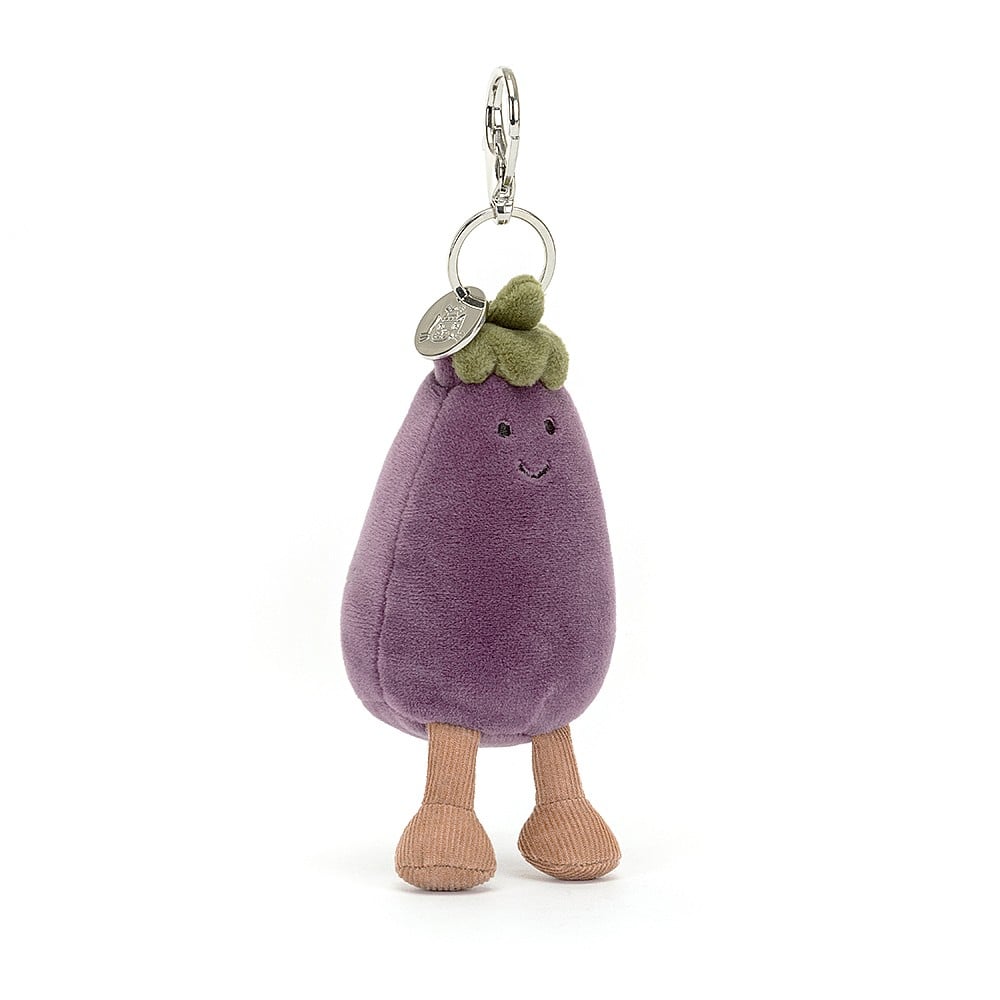 Angled View:  Sitting pretty! The Jellycat Vivacious Aubergine Bag Charm rests at an angle, showcasing its luxuriously soft purple fur, vibrant green stalk, and a touch of silver.
