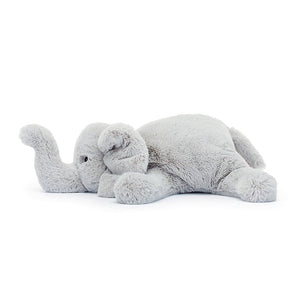 Side view of tranquility: Jellycat Wanderlust Elly showcases her soft fur, gentle curves, & calming presence from the side. Ready for cuddly adventures!