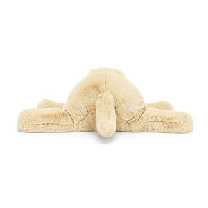 Wagging tail & endless cuddles: The back view of Jellycat's Wanderlust Puppy reveals his soft fur, playful form, & adorable design. Perfect for cozy snuggles after adventures.