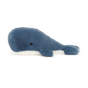 Side View: Adventure awaits! The Jellycat Wavelly Whale Blue boasts deep blue fur, fuzzy flippers, and a curious expression. Perfect for ocean adventures on-the-go!