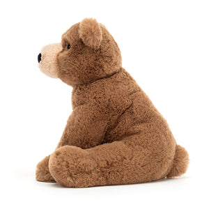 Side View: Spark your child's imagination with Woody Bear! (26 cm tall). This cuddly teddy bear boasts soft fur, a friendly face, and is perfect for inspiring forest adventures.