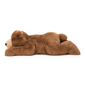 Side View: Spoil your little one (or yourself!) with Woody Bear Lying! (47 cm tall). This giant teddy bear boasts soft fur, a relaxed pose, and is perfect for bedtime snuggles or playtime adventures.