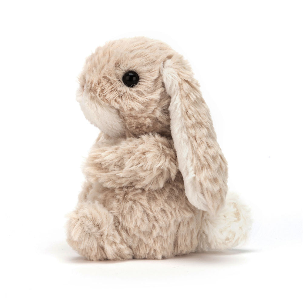 Side view of Jellycat Yummy Bunny Beige sitting upright.