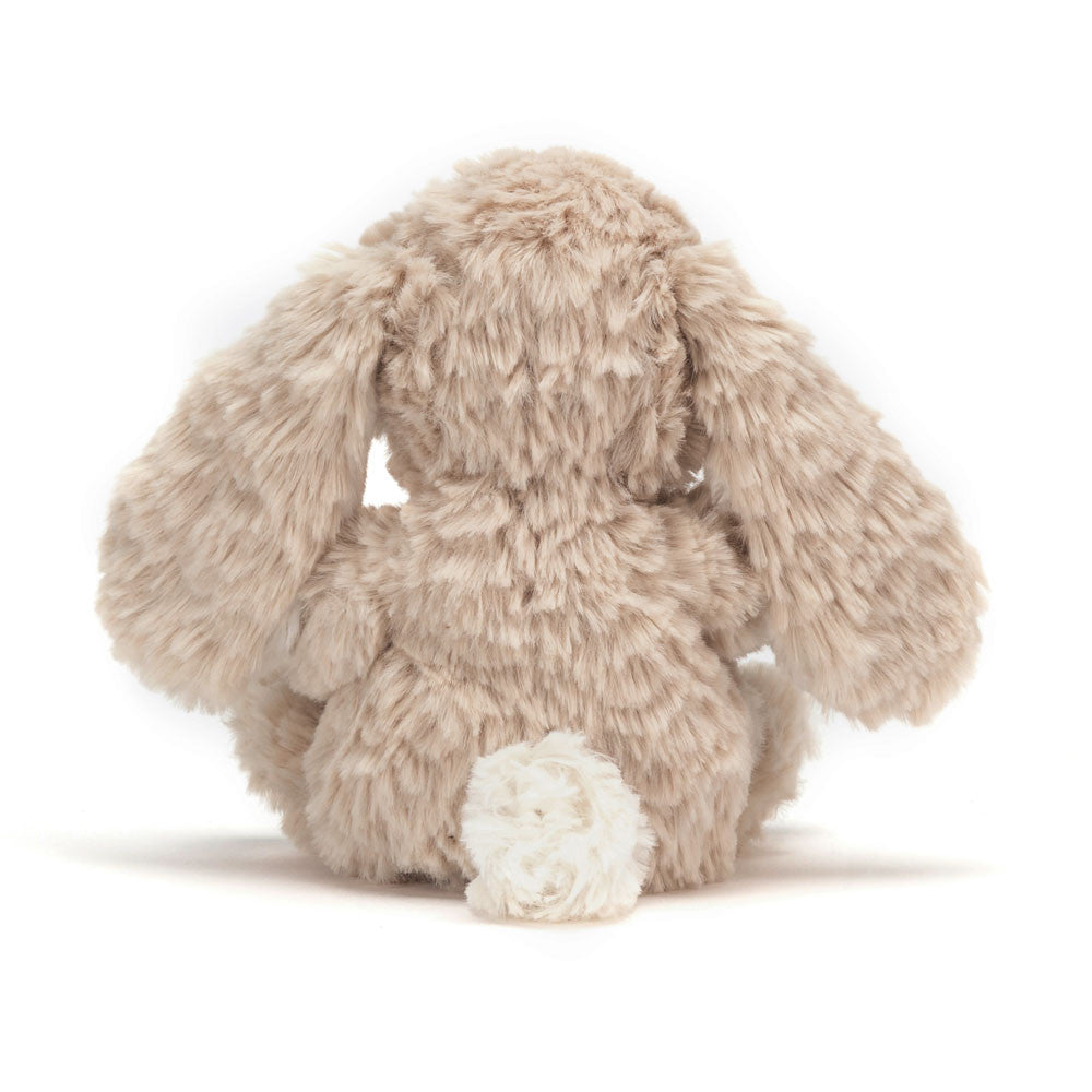 Rear view of Jellycat Yummy Bunny Beige with white fluffy tail.