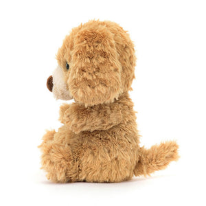 Side view of the Jellycat Yummy Puppy Children's soft toy with his little paws sitting out in front and tail behind. 
