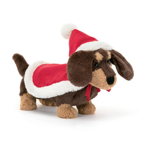 Festive fashion for Fido! The Jellycat Winter Warmer Otto Sausage Dog (15cm x 7cm) wears a red hat & cape with a pompom, perfect for the holidays.