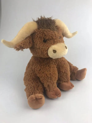 Side view of the Jomanda horned highland cow plush soft toy.