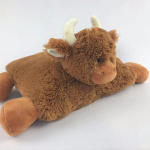 Stretched out, the Jomanda Large Scottish Highland Cow Pillow is a soft and fluffy pillow with squishy hooves and horns.