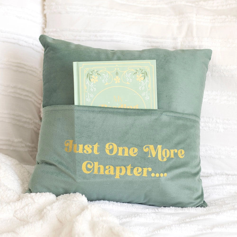 Pale green “Just One More Chapter” cushion with book pocket.