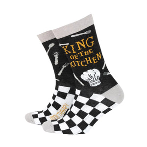 Men’s black bamboo socks with “King of the Kitchen” slogan, chef’s hat, utensils, and black-and-white checkerboard pattern.
