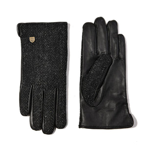 Flat lay of Harris Tweed® gloves showing both the tweed top and smooth black leather palm with touchscreen pad on thumb.