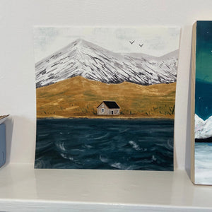 Scenic illustration print of Loch Lomond with wooden house, mountain, and loch waves.