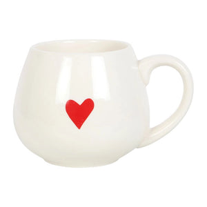 White ceramic mug with a bright red heart painted on the front.