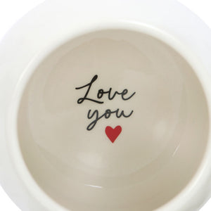 Inside the mug showing the hidden message which says I Love You with a little red heart below.