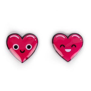 Two reusable Lovely Jubbly heart hand warmers with smiley faces