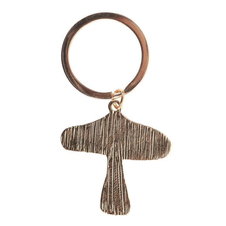 Back of toadstool keyring showing textured brushed-metal finish.