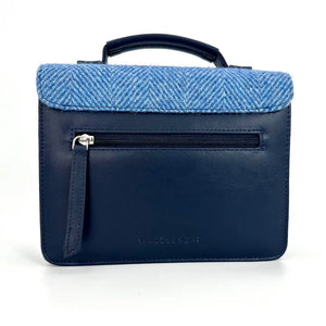 Back of Sky Blue Harris Tweed Mini Bag with navy vegan leather and zippered pocket.