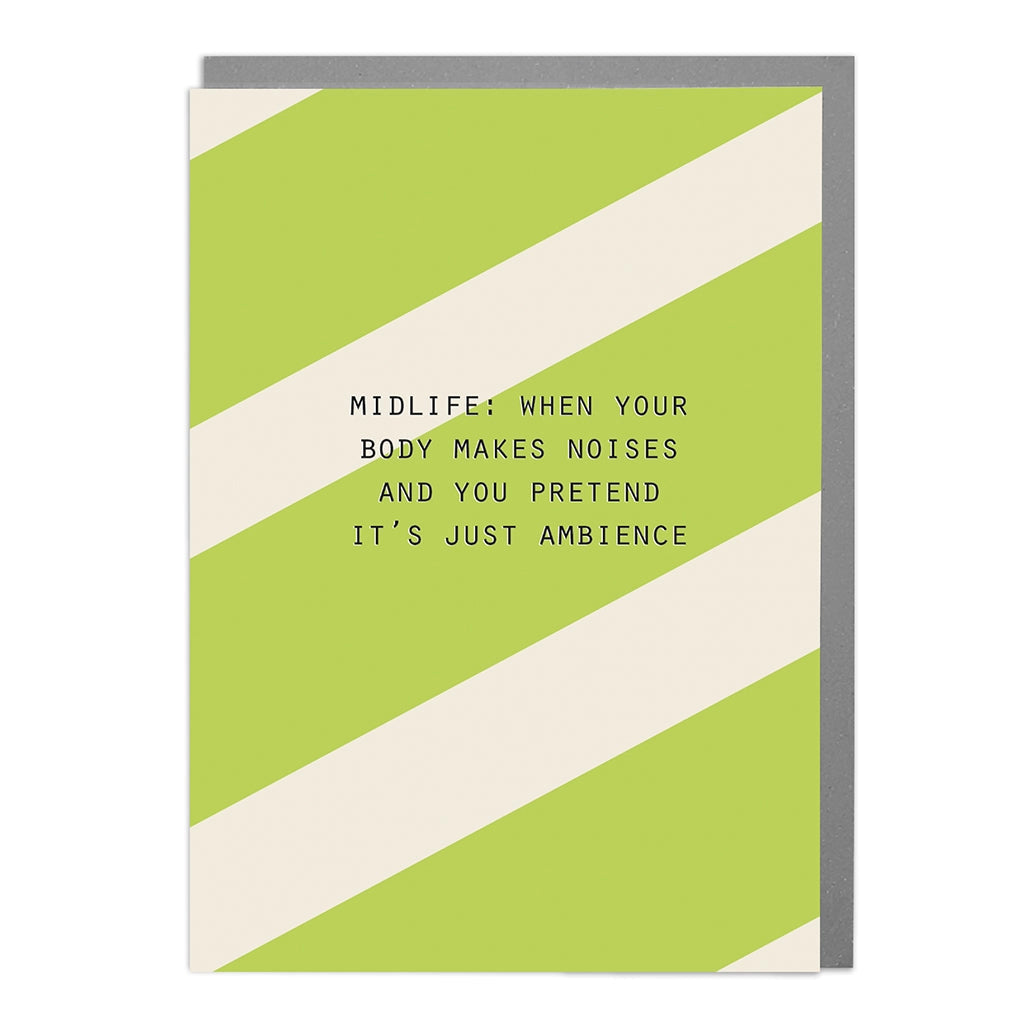 Front of Midlife Noises Humorous Card featuring green and cream diagonal stripes with the quote “Midlife: when your body makes noises and you pretend it’s just ambience.”