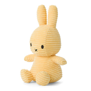 Angled: Soft and huggable Miffy bunny plush in a delightful buttercream corduroy.
