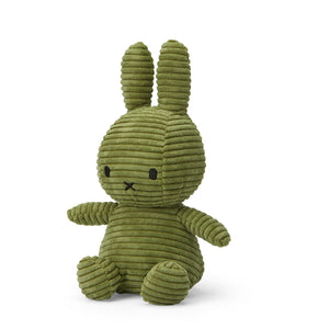 Angled: Adorable Miffy bunny plush in a soft olive green corduroy.