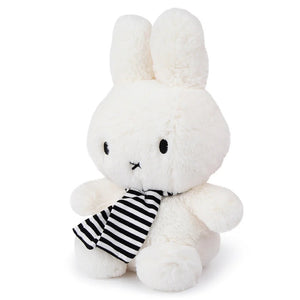 Side view of Miffy Winter With Scarf 33cm plush showing soft high-pile fur and striped scarf.