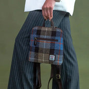 Blue And Brown Check Harris Tweed mini backpack worn by model - lifestyle shot.