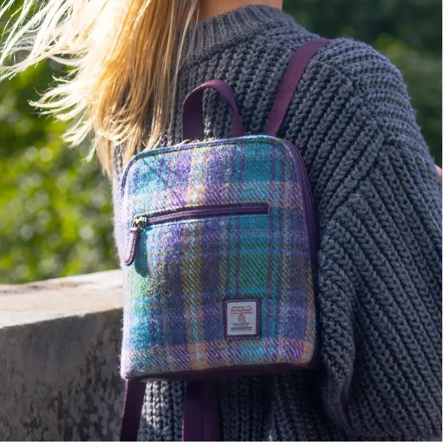Green And Purple Plaid Harris Tweed mini backpack worn by model - lifestyle shot.