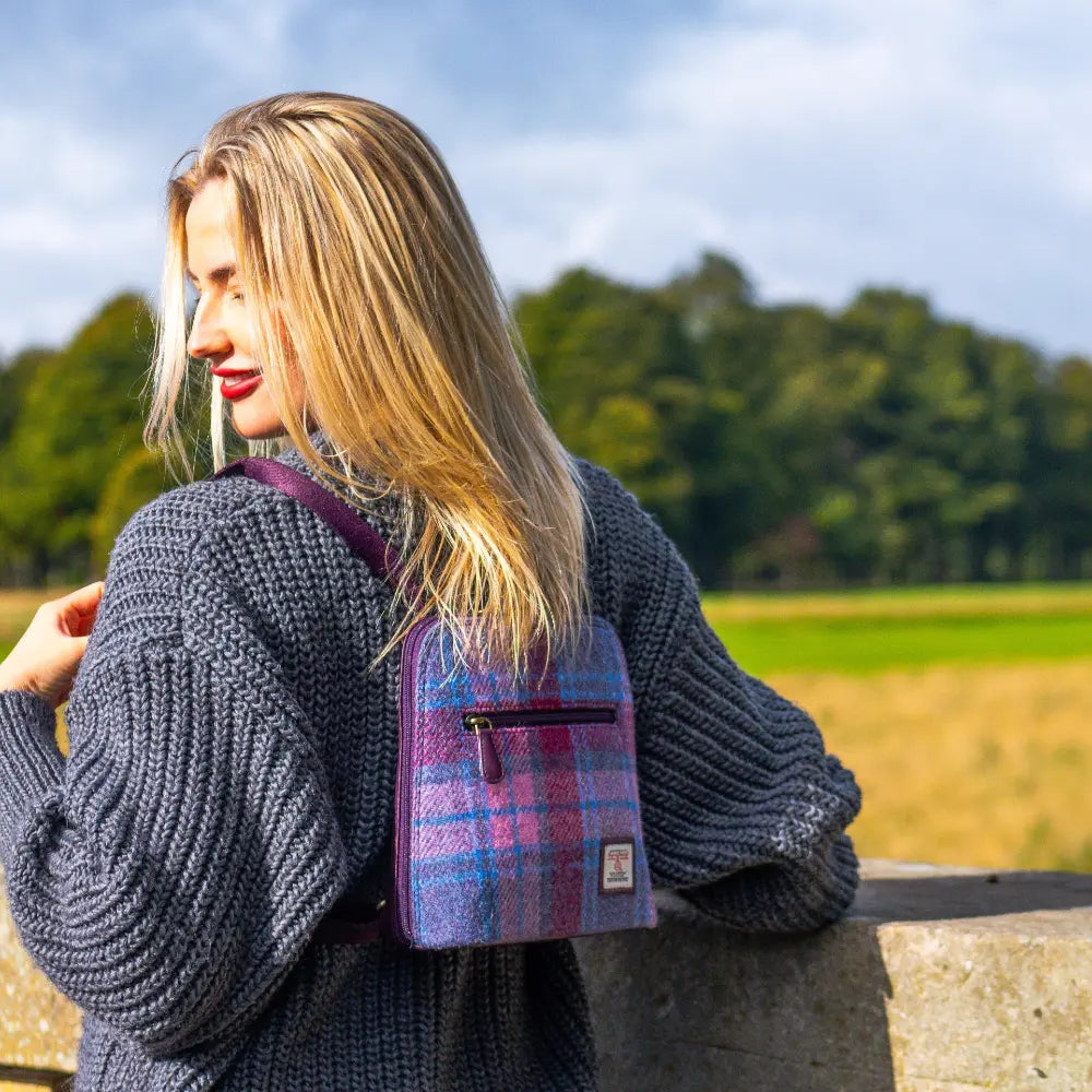 Pastel Pink Harris Tweed mini backpack worn by model - lifestyle shot.