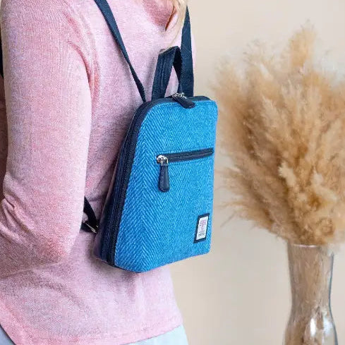 Sky Blue Harris Tweed mini backpack worn by model - lifestyle shot.