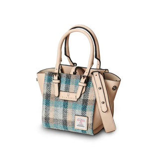 Islander Mini Caillie Tote in Islander Cream and Blue Tartan, viewed from the side with a folded silhouette.