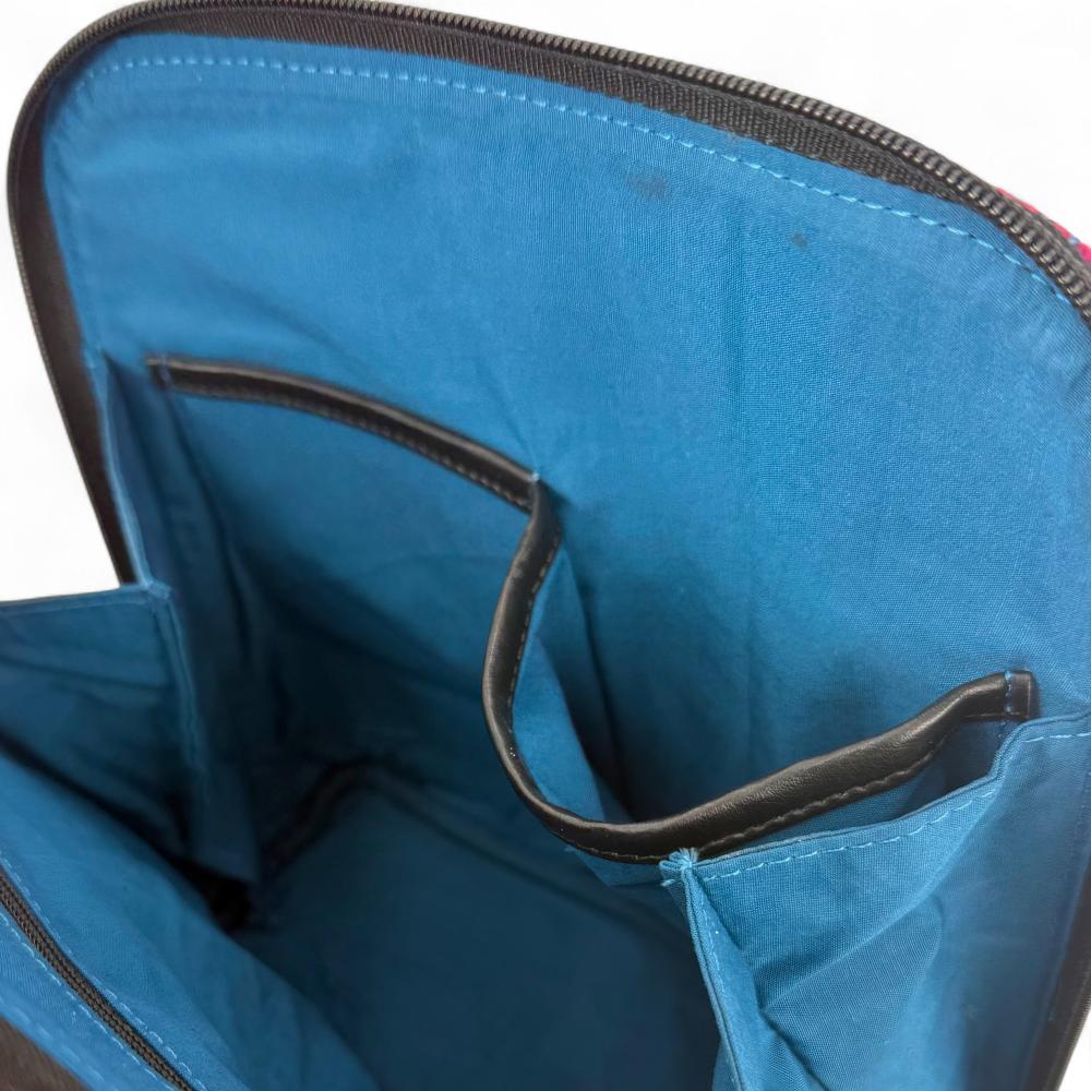 Blue And Pink Check Harris Tweed mini backpack interior showing zip pocket and lining.