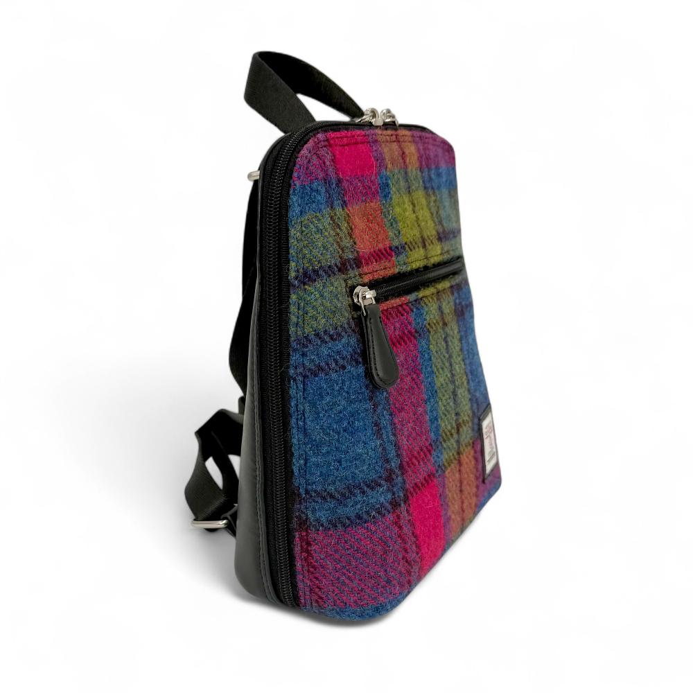 Blue And Pink Check Harris Tweed mini backpack side view showing zip pocket on white background.