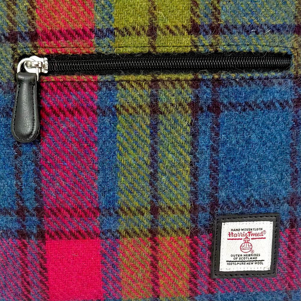 Close-up of blue and pink check Harris Tweed check texture and label.