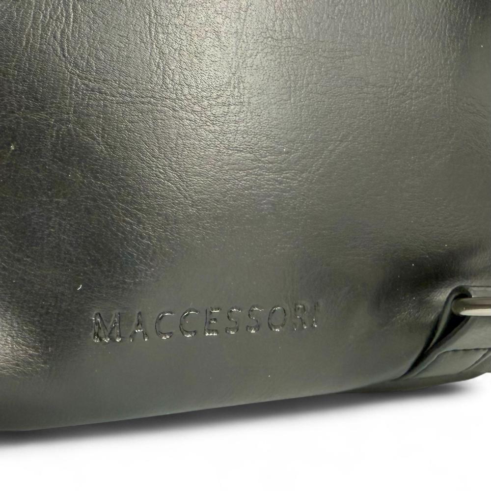 Maccessori embossed branding on navy vegan leather back panel.
