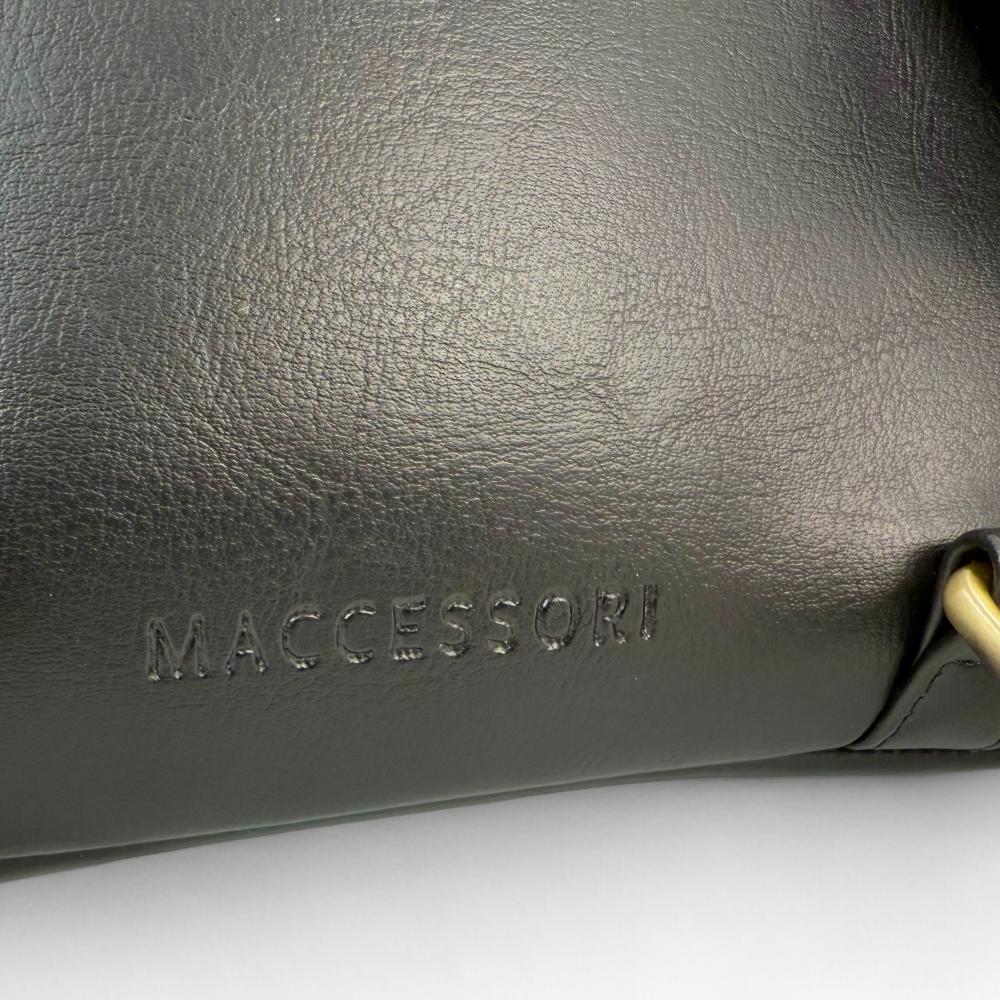 Maccessori embossed branding on black vegan leather back panel.