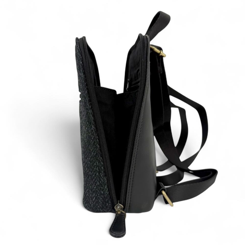 Charcoal Harris Tweed mini backpack open side view showing zip-to-base design.