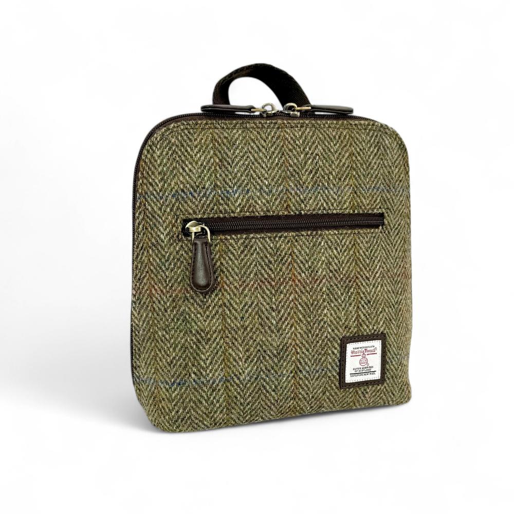 Country Green Harris Tweed mini backpack front angled view on white background.